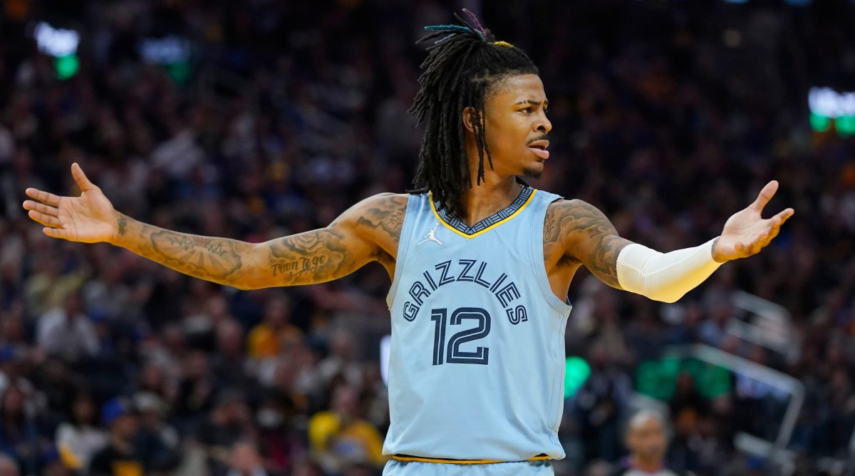 Grizzlies guard Ja Morant (12) reacts to an official’s call.